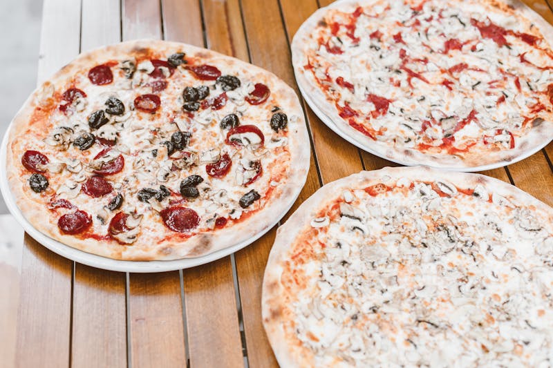 Quattro Stagioni four seasons punch pizza with artichokes and mushrooms