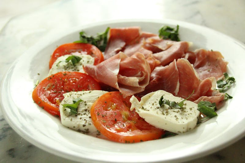 Insalata Caprese salad with tomatoes, mozzarella and basil