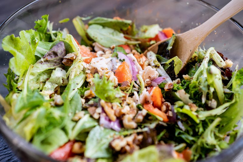 Punch House Salad with mixed greens, walnuts, and house vinaigrette